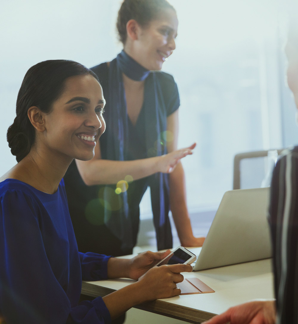 two women in a professional setting