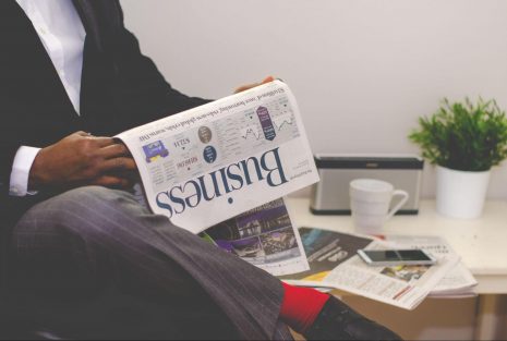 person reading a newspaper