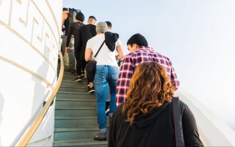 people waiting in line on stairs